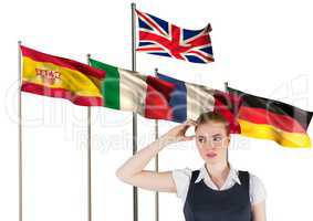 main language flags behind young businesswoman thinking