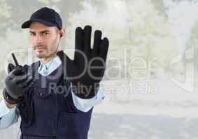 Security man outside bright background street with trees
