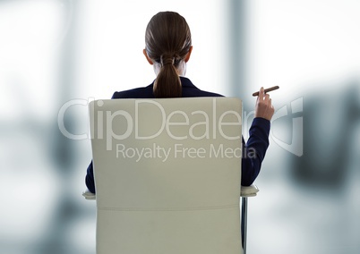 Businesswoman Back Sitting in Chair with cigar and bright windows