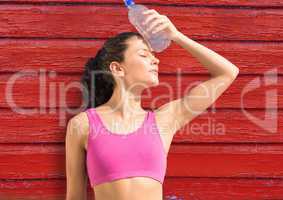 fitness woman with water with red wood background