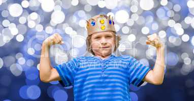 Child with king crown and blue tee shirt and blue background