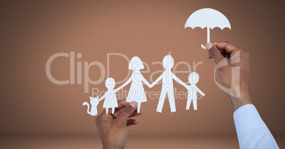 Cut out family and umbrella protection in hands