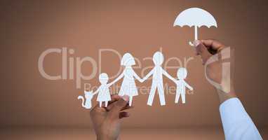 Cut out family and umbrella protection in hands