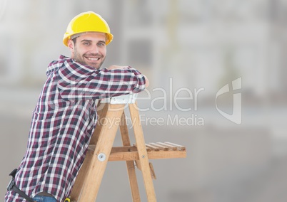 Construction Worker on ladder in front of construction site