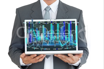 Businessman holding a laptop with graphics