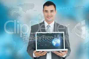 Businessman showing a laptop against world wide map background