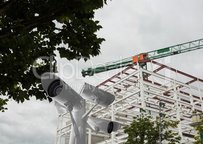 the top of the cctv stick in front of the scaffolding