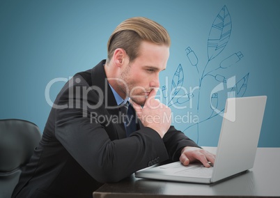 Business man thinking at laptop against blue background with blue leaf graphic