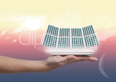 solar panel on hand with night and day background