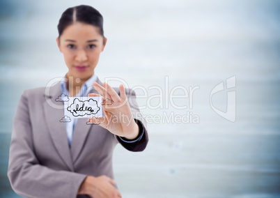 Business woman holding out card showing idea doodles against blurry blue wood panel