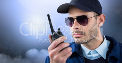 Security man outside with clouds