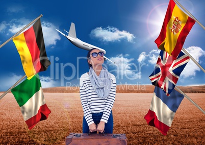 main language flags around young woman with suitcase. field background with plane