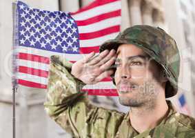 soldier in front of building with usa flag behind/ Saluting