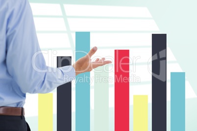 Part of businessman in front of different graphics