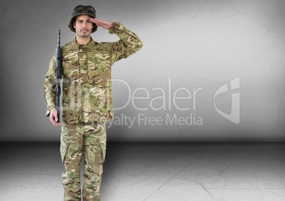 soldier saluting and with weapon. Concrete room