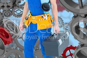 Handyman against background with 3D cogs