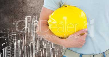 Part of construction worker holding his yellow hard hat