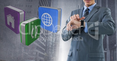 Businessman holding watch with apps icons with city background
