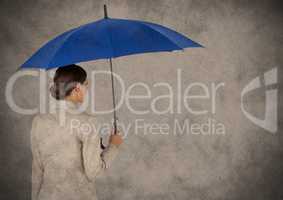 Back of business woman with umbrella against brown background and grunge overlay