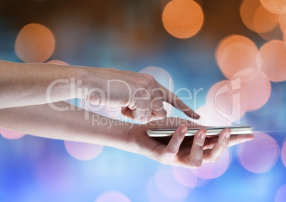 Hands with mobile phone  with sparkling light bokeh background