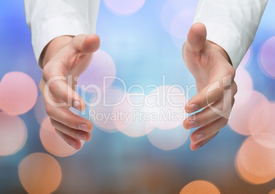 Hands holding invisible space with sparkling light bokeh background