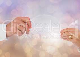Old Couple Hands reaching with sparkling light bokeh background