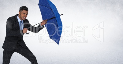 Business man with umbrella blocking rain against white background