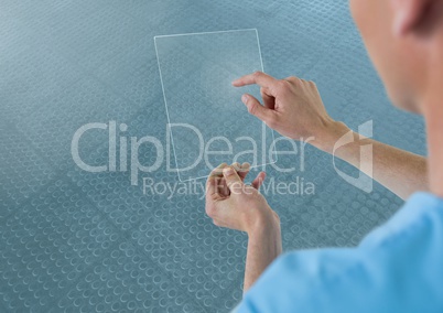 Doctor holding glass tablet and blue background