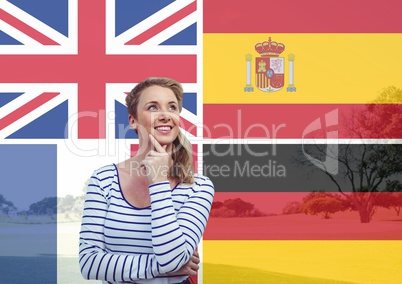 main language flags overlap with field behind young woman imagining