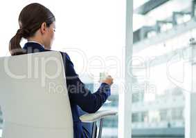 Businesswoman Back Sitting in Chair with  cigar and buildings