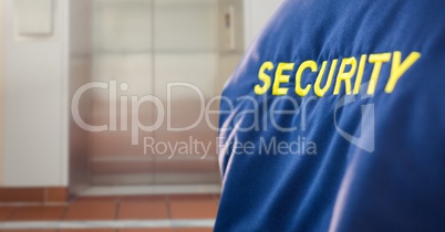 Security man outside lift door