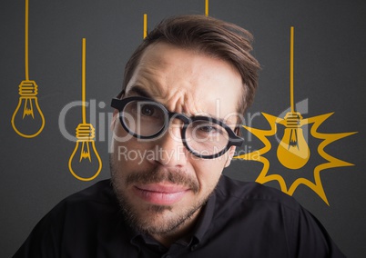 Close up of confused man with glasses against grey background with yellow lightbulb graphics