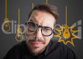 Close up of confused man with glasses against grey background with yellow lightbulb graphics