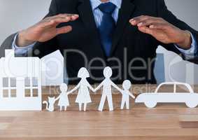 Models hands protecting house family and car cut outs