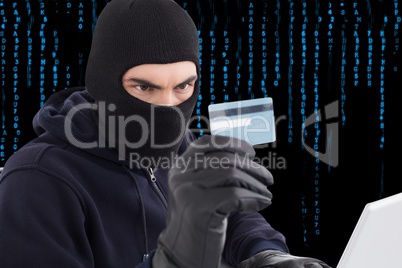 Hacker holding a credit card