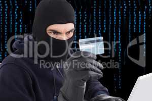 Hacker holding a credit card