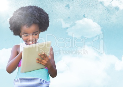 Kid with tablet against sky with flare