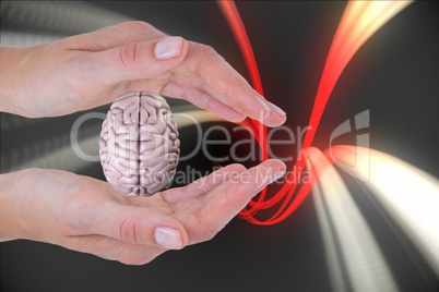 Brain on hands with a digital background