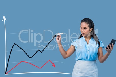 Businesswoman drawing graphics on the screen against blue background