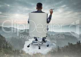 Businessman Back Sitting in Chair with cigar on cloud over mountain landscape