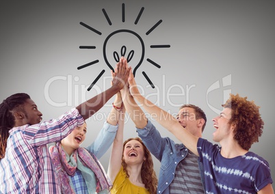Trendy team putting hands together against lightbulb graphic and grey background