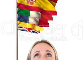 main language flags over foreground of blond hair woman looking up