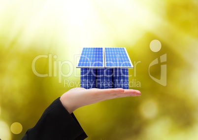 solar panel on hand. solar battery roof/ Green lights background