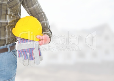 Construction Worker with safety helmet in front of construction site