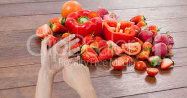 Hand taking picture of fruits and vegetables through device
