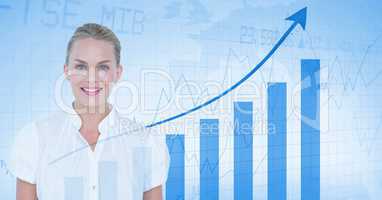 Digital composite image of businesswoman standing against graph showing growth