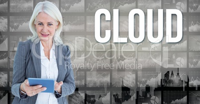 Digital image of businesswoman holding book standing by cloud text against graphs
