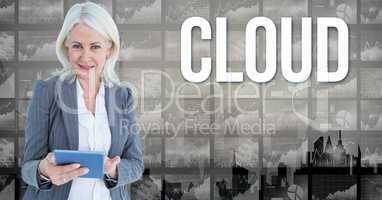 Digital image of businesswoman holding book standing by cloud text against graphs