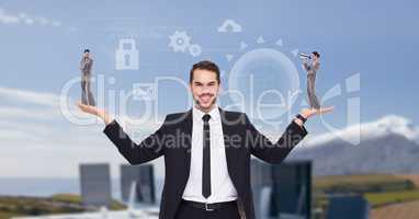 Digital image of businessman carrying businesswoman with symbols while standing against computers an