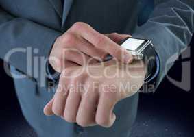 Businessman holding watch with dark ground background